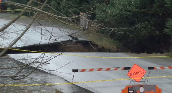 Rumming Road in Lantzville, washed out Monday morning. A woman had to be rescued after her vehicle plunged down over the side.