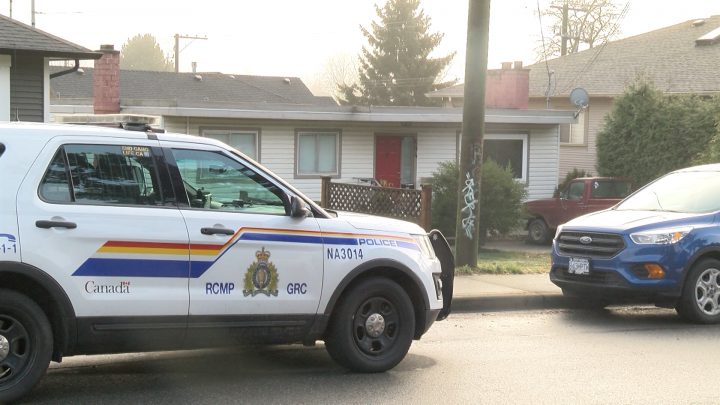 Police outside the residence of the home invasion