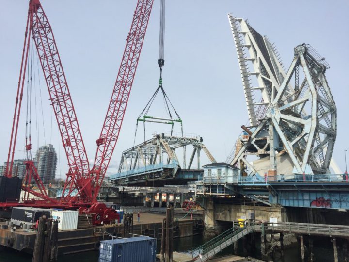 The Dynamic Beast removing the main deck span of the old Johnson Street Bridge in April (Photo courtesy of City of Victoria)