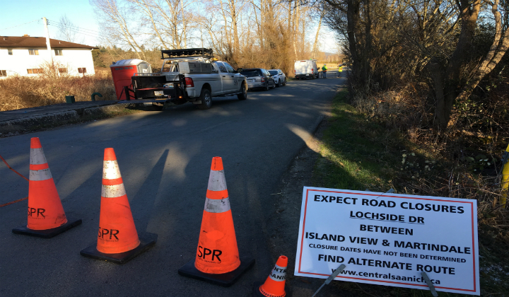 Work underway to remove crane lying in Central Saanich ditch