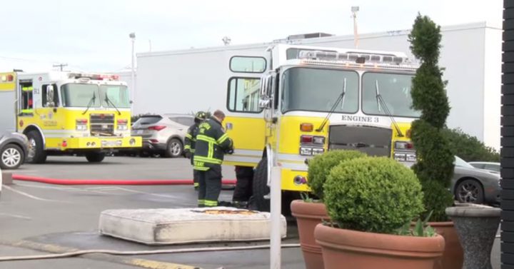 Firefighters in Victoria cleaning up after extinguishing hotel fire