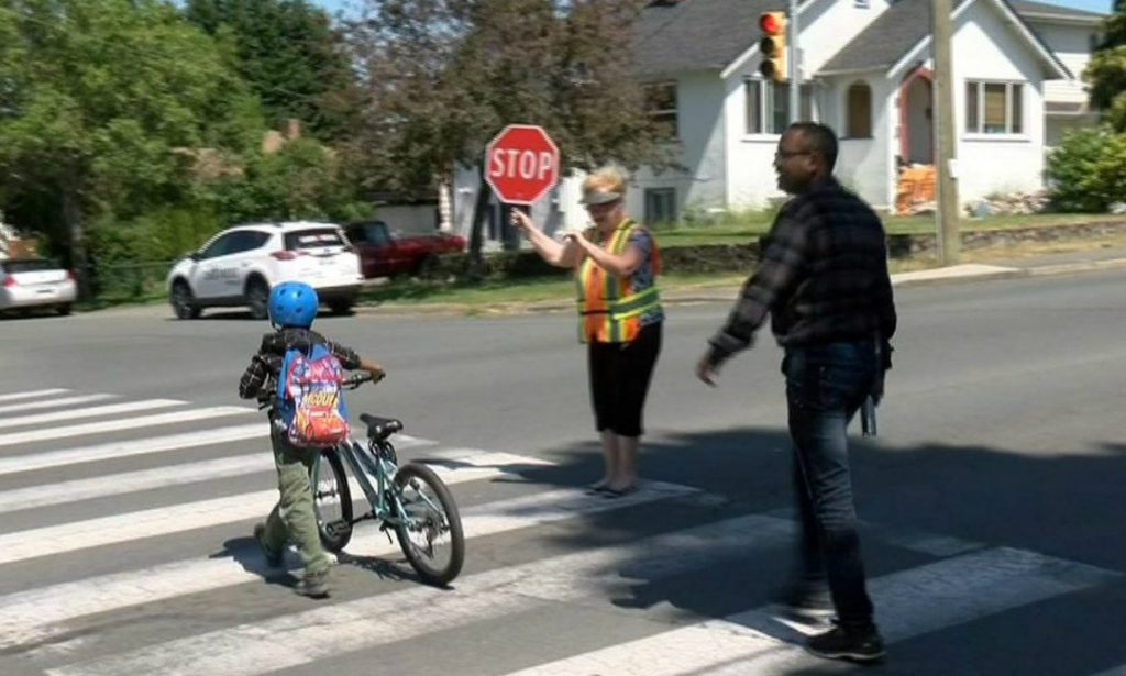 Parents launch petition to save their school crossing guard as the District of Saanich undertakes review