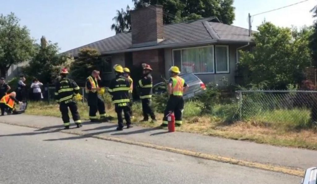 Nanaimo RCMP says driver ran red light leading to two car crash, vehicle slamming into house