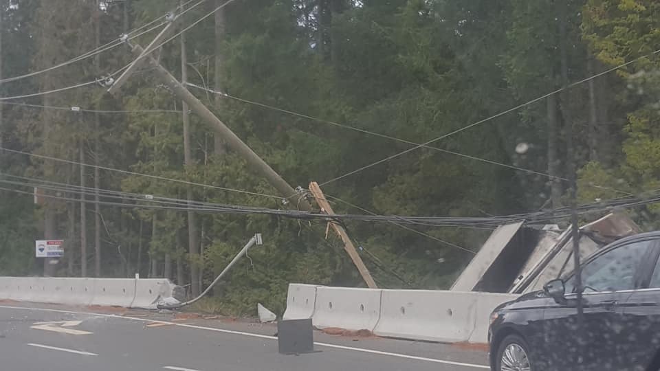 Power knocked out after truck crashes through concrete barrier, hits utility pole on the Malahat