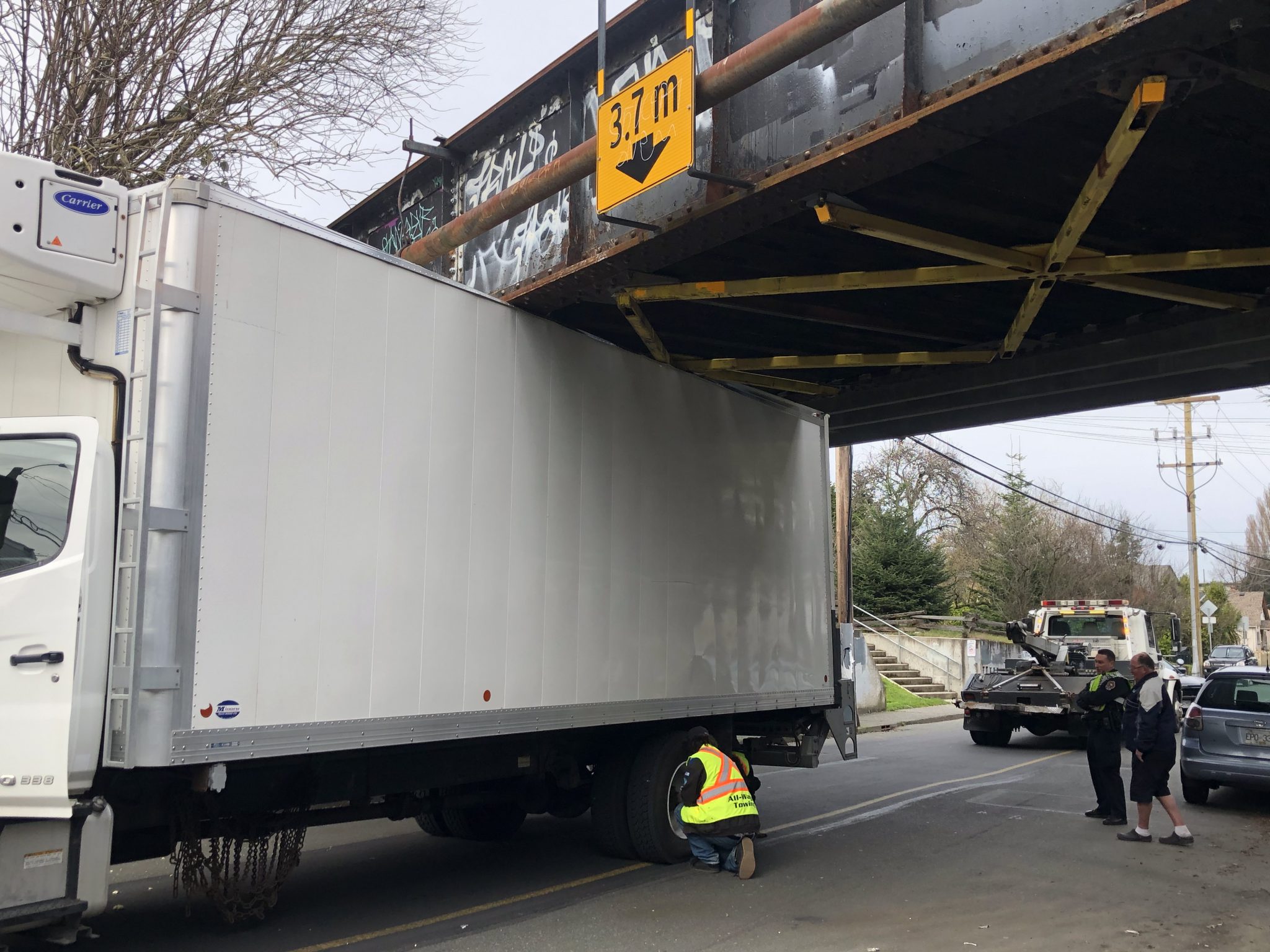 Another truck gets stuck under rail bridge in Vic West