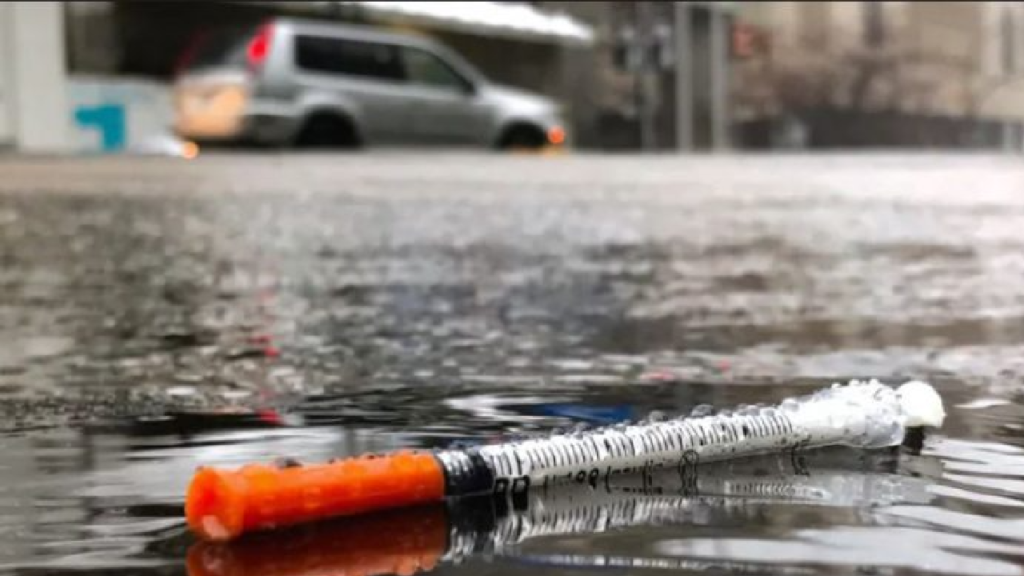 Victoria police officer stabbed with needle while administering naloxone to unconscious person