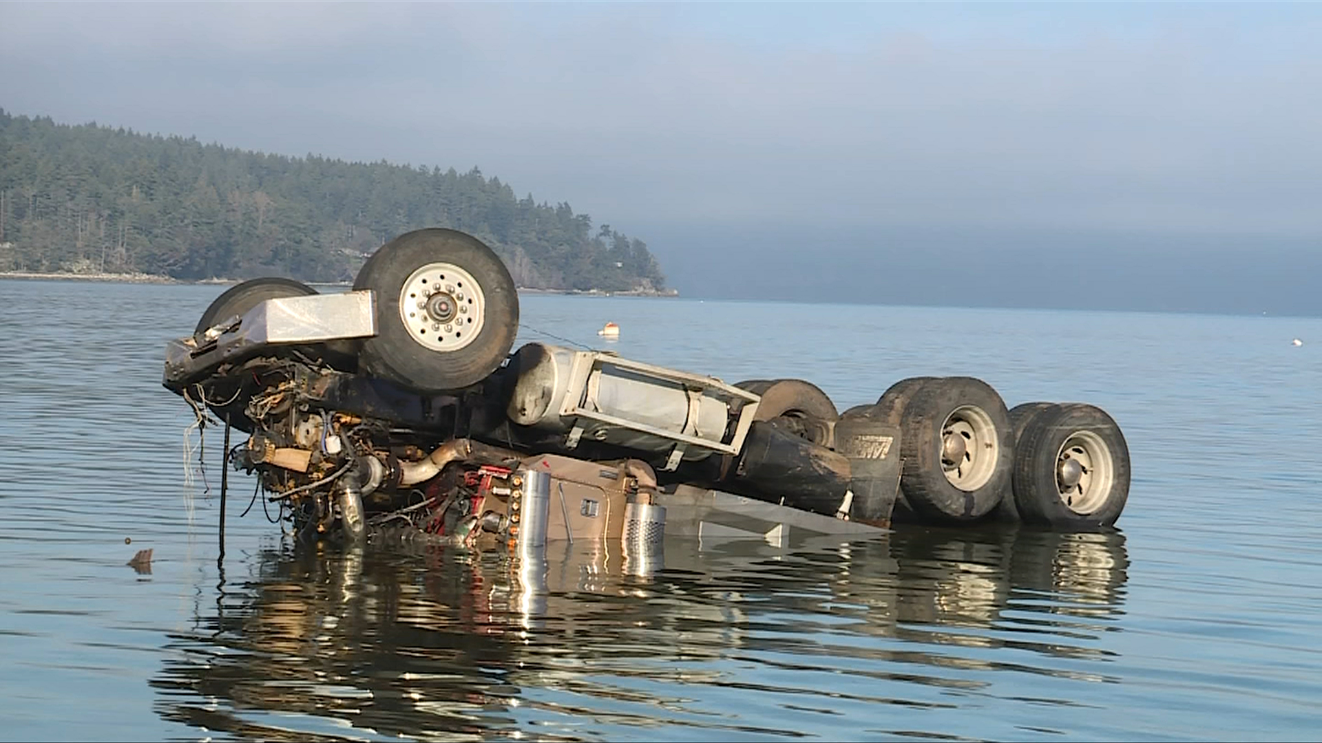 Mill Bay Woman Rescues Dump Truck Driver Whose Truck Fell 18 Feet Into