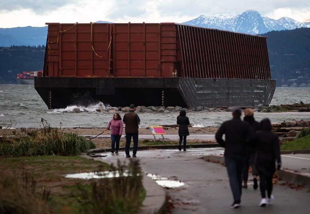 Salvage work begins to remove barge stuck for months on Vancouver beach