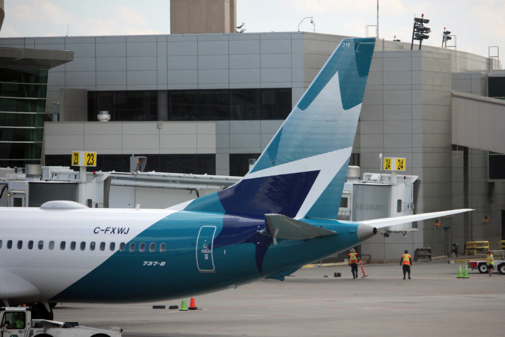 WestJet says it's back online after global outage, but more disruptions expected