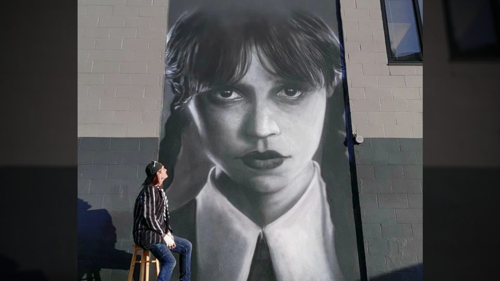 Victoria airbrush artist covers graffiti with massive mural of Wednesday Addams