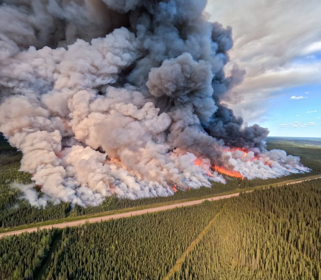 Crews ready to protect key northeast B.C. highway, but cooler weather slows wildfires