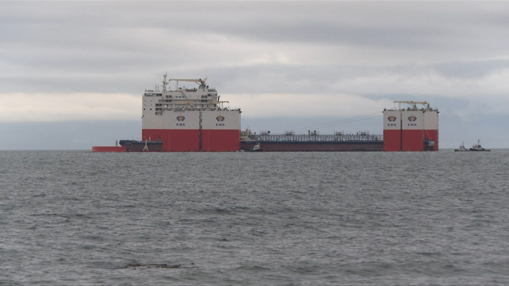 Massive semi-submersible cargo ship anchors near Victoria