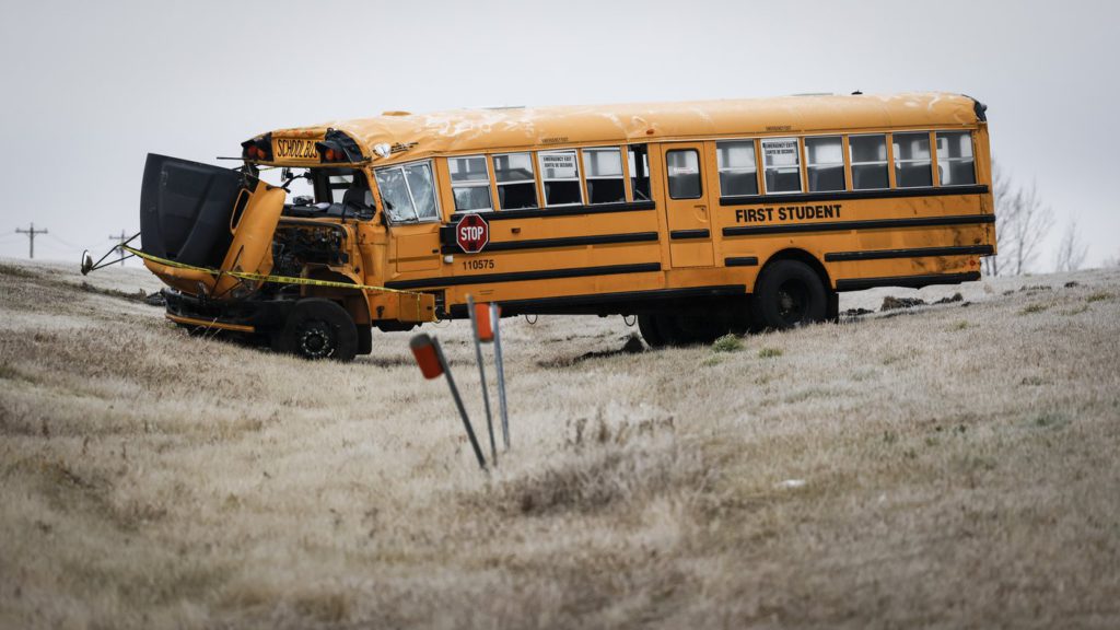 Five students, one adult taken to hospital after school bus rolls north of Calgary